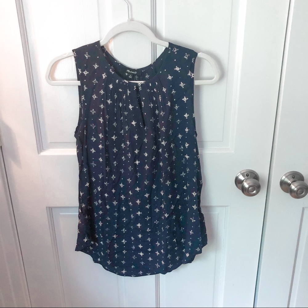 Green sleeveless blouse
